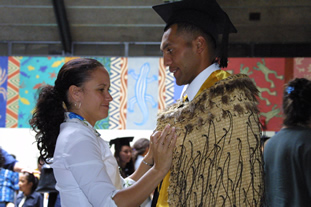 Young man receiving his diploma from the Commonwealth Youth Programme (CYP) South Pacific in New Zealand.
