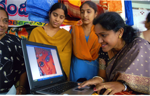 Girls looking at computer